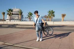 Young woman using her folding bike