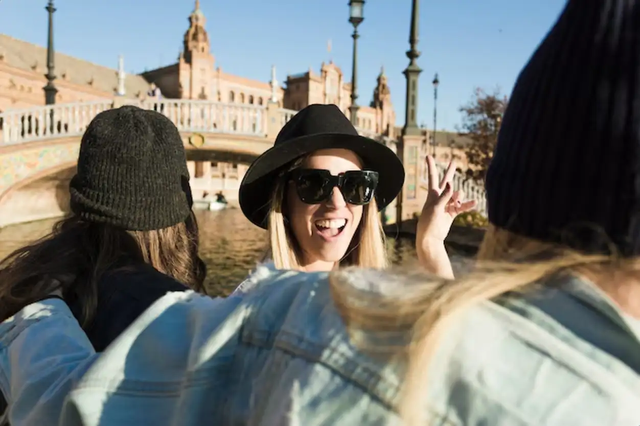 Cheerful women floating on river