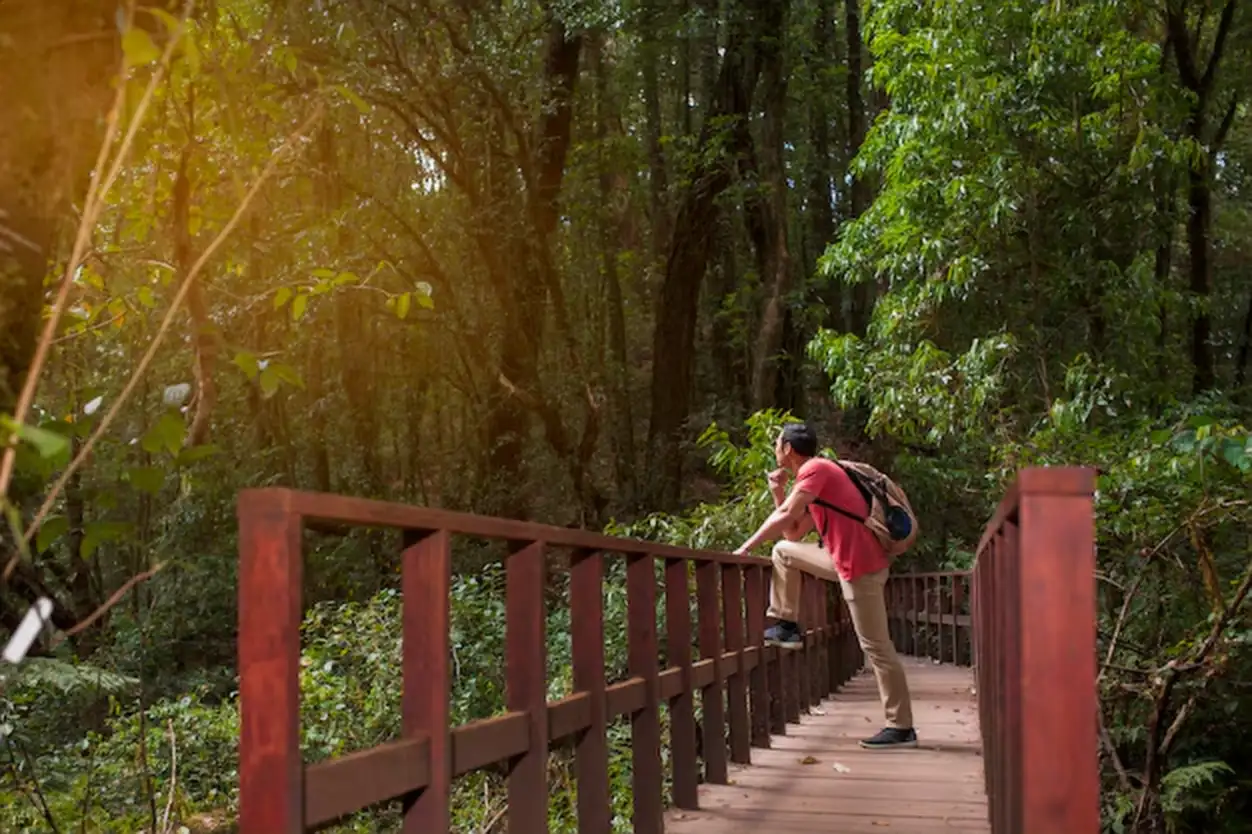 Hiker chilling on old bridge